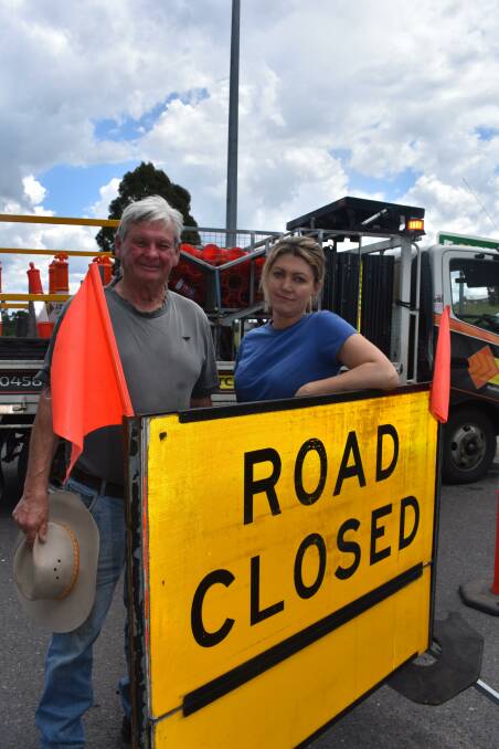Frustrated livestock producers Percy Stephens, Yarra Glen, and Melissa White,Dixons Creek, at the barrier on the Melba Highway, near the Yarra River, Yarra Glen. Picture by Andrew Miller.