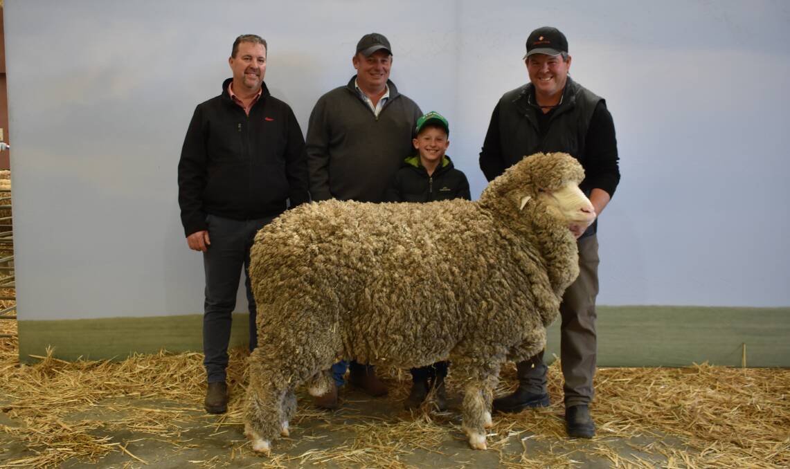 Elders stud stock representative Nathan King, Darkan, WA, buyer Anthony Frost, Crookwell, NSW, his son Jack, 10, and vendor Jeremy King, Rangeview Poll Merino, Darkan, WA with the top-priced ram. Picture by Andrew Miller