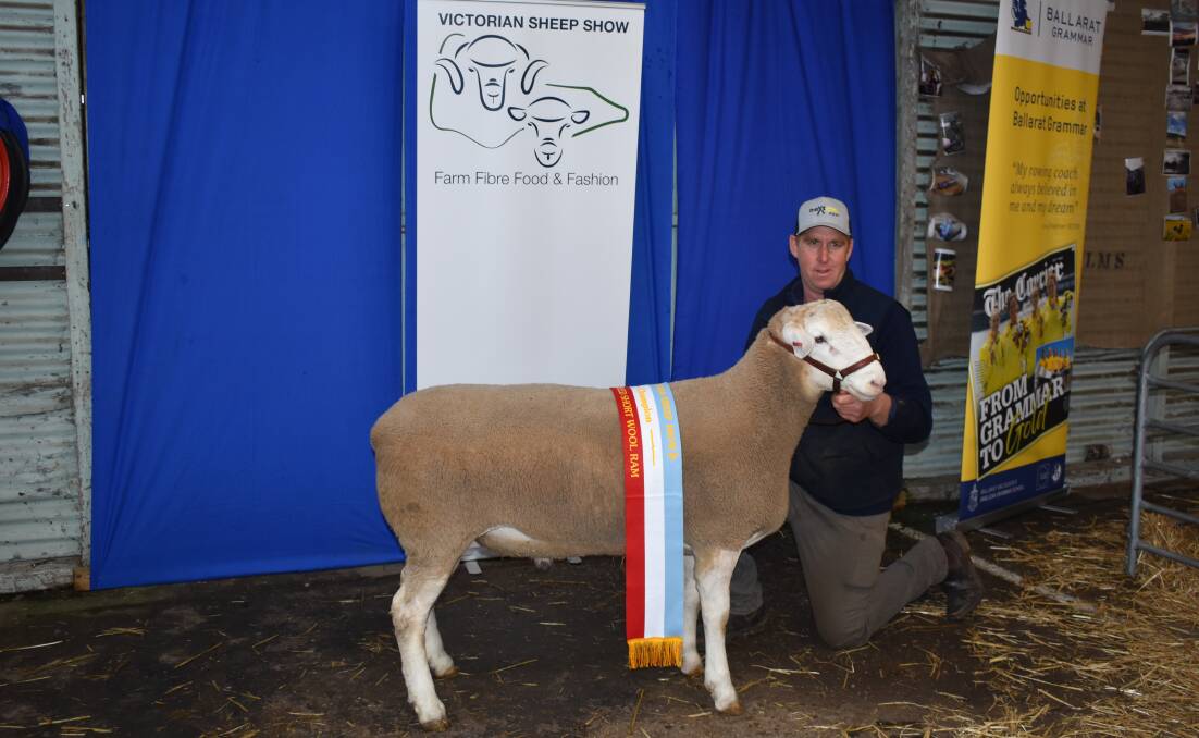 Tim Ferguson, Mallee Park Poll Dorset and White Suffolk studs, with the champion interbreed short wool ram, a White Suffolk, at the Ballarat Victorian Sheep Show. Picture by Andrew Miller