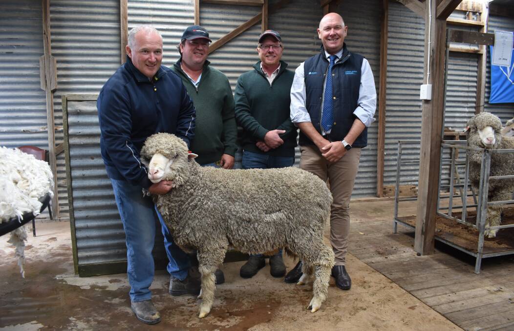 The top-priced ram with AWN auctioneer Geoff Rice, Parkes, stud principal Will Lynch, Glenthompson, buyer Peter Wallis, Keith, SA, and classer Dale Bruns, Dunkeld. Picture by Andrew Miller