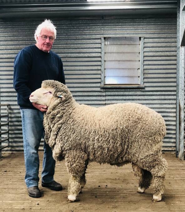 SALE TOPPER: Rock-Bank stud principal John Crawford with the sale-topping ram.