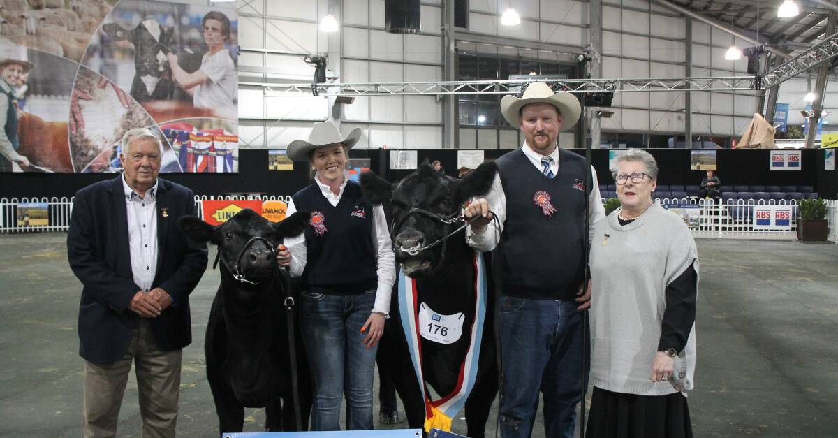 NO SHOW: Last year's Royal Melbourne Show supreme champion beef exhibit KO Dream N43 with Annie Pumpa, Tim Lord and Noelene King. Mr Lord said the cancellation of shows could have a financial impact.