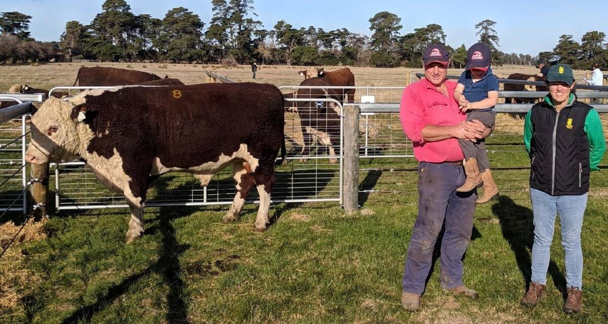 LOCAL WINNER: Andrew and Beau McLauchlan, Valma Poll Hereford stud, and Victoria Archer, Quamby Plains, with the top-priced bull.