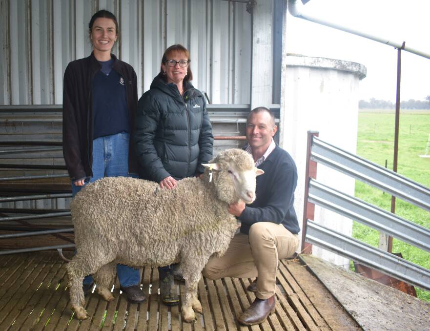Edwina Sleigh, Ruffy, Anna Toland and Simon Riddle, Toland Merinos, Violet Town, with one of the two top-priced rams. Both sold for $10,500 each. Picture by Andrew Miller.