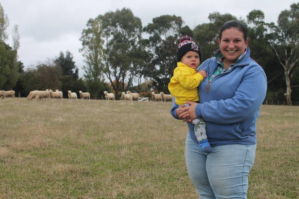 Nikki Hurn, Creswick, with son Dylan, runs a small farm with her husband Paul, at Kingston - their plans to expand have been thwarted by high land prices and stamp duty. Picture by Philippe Perez