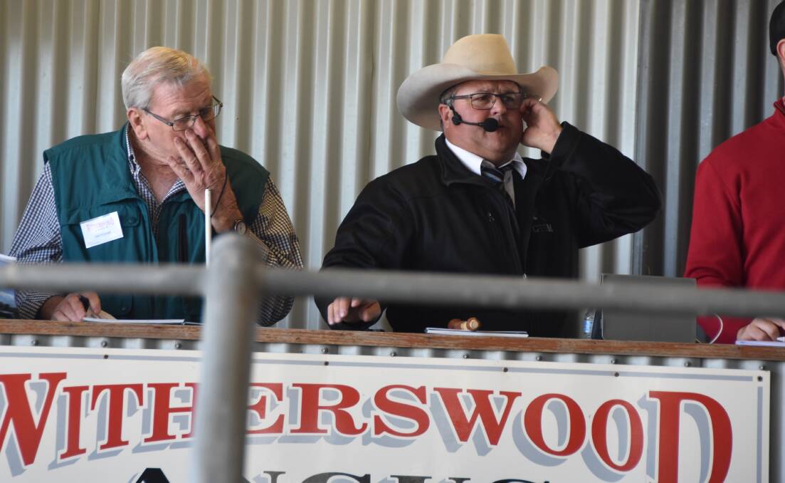 SUCCESSFUL SALE: Withersood Angus stud principal John Woodruff with GTSM auctioneer Michael Glasser, at the complete female dispersal.