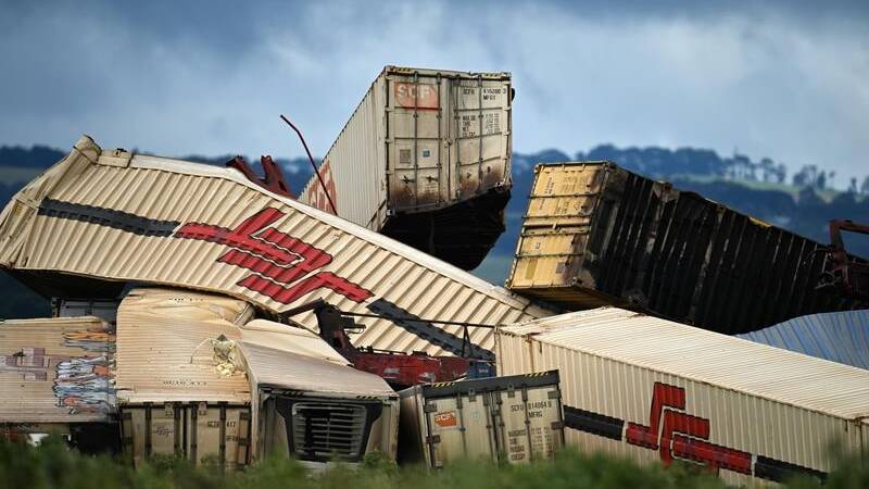 Dozens of shipping containers lay piled up after a freight train derailed in Victoria's west. Picture by James Ross/AAP.