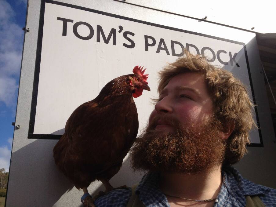 TOM'S PADDOCK: Glenburn egg and beef producer Tom Abbottsmith Youl with one of his chickens.