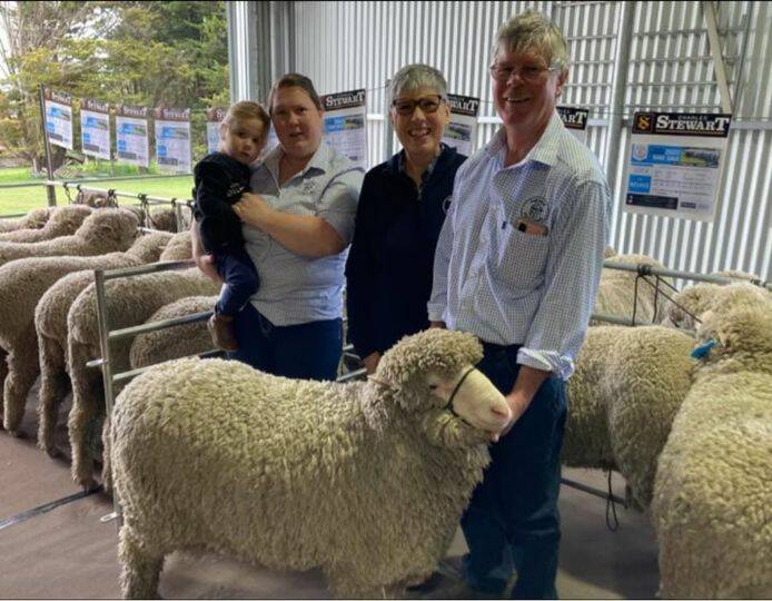  Kaye, Greg and Sam Potter with three-year old Dulcie Dickson, Barangarook, and the top-priced ram. The ram sold for $3050 to an undisclosed NSW bidder. Picture supplied by Fairview