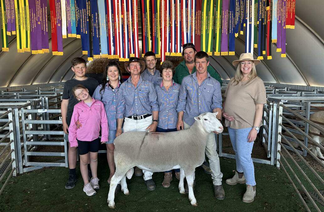 The Jorgensen family with the sale-topping White Suffolk ram. Picture supplied