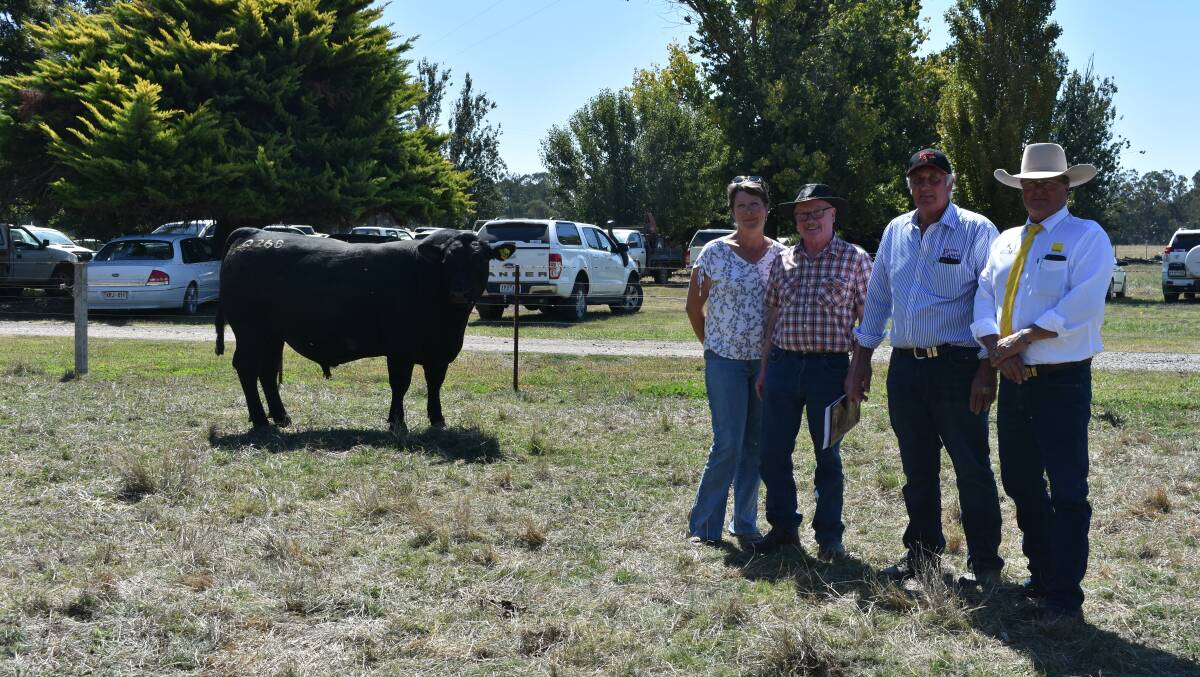 GIPPSLAND BUYERS: Kevin and Maree Opray, Hedley, with Prime stud principal Colin Flanagan and Ray White GTSM auctioneer Michael Glasser, and the top-priced bull.