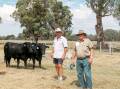 Stud principal Ian Bates, the top priced buyer Merv Steer, Eyton on Yarra, Healesville, manager and the top-priced bull. Picture by Jaccob McKay.