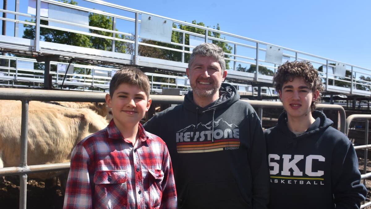 Harry, 13, Simon and Charles, 16 Wilson from Melbourne were visiting family members at Barfold and came along to the Kyneton store sale. Picture by Andrew Miller