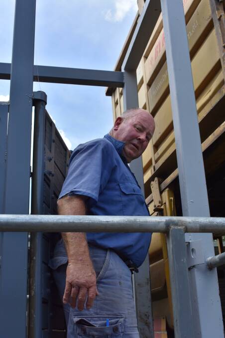 SAFE GATE: Romsey livestock transporter John Beer, demonstrates the simple safety solution, a gate at the top of the ramp, which helps separate stock and drivers.