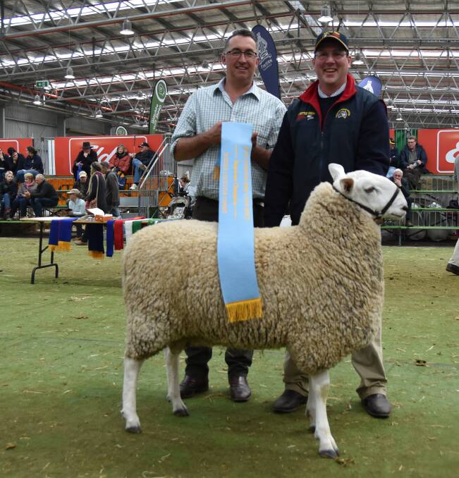 Andrew Storey, Border Leicester judge, with the Supreme Champion and Wattle Farm's Jeff Sutton.