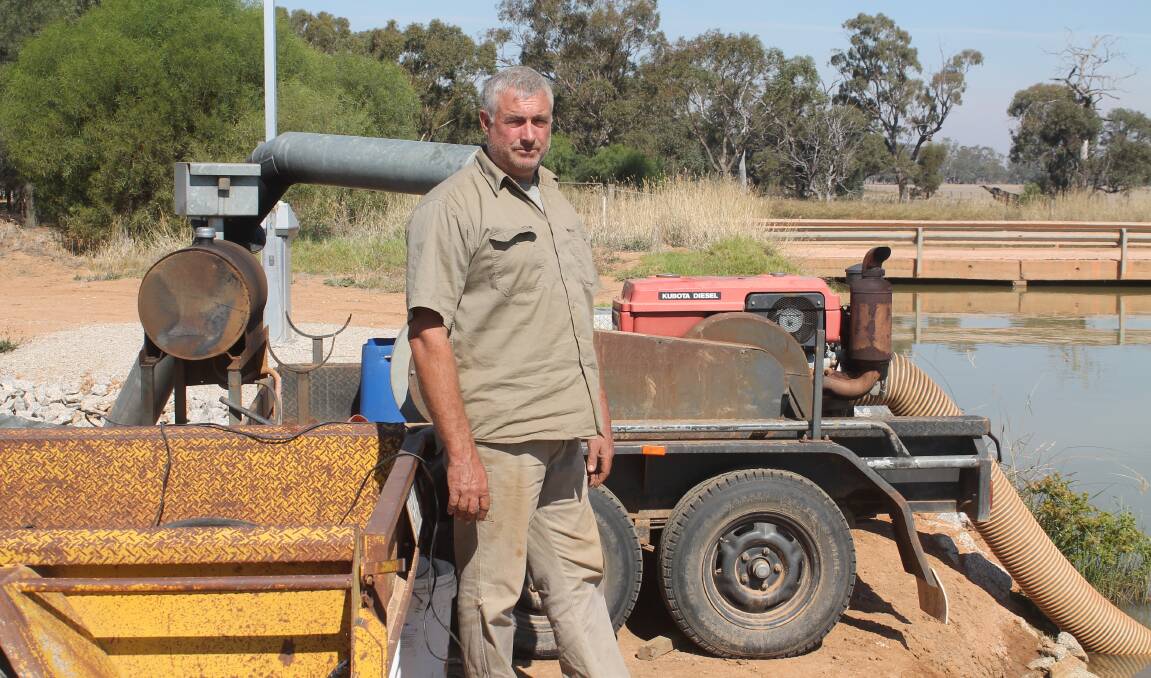 PUMPING SYSTEM: Adam Wright, with one of the pumps installed by Goulburn-Murray Water (GMW) for last season: he said he fully expected the same thing to happen again, this year.