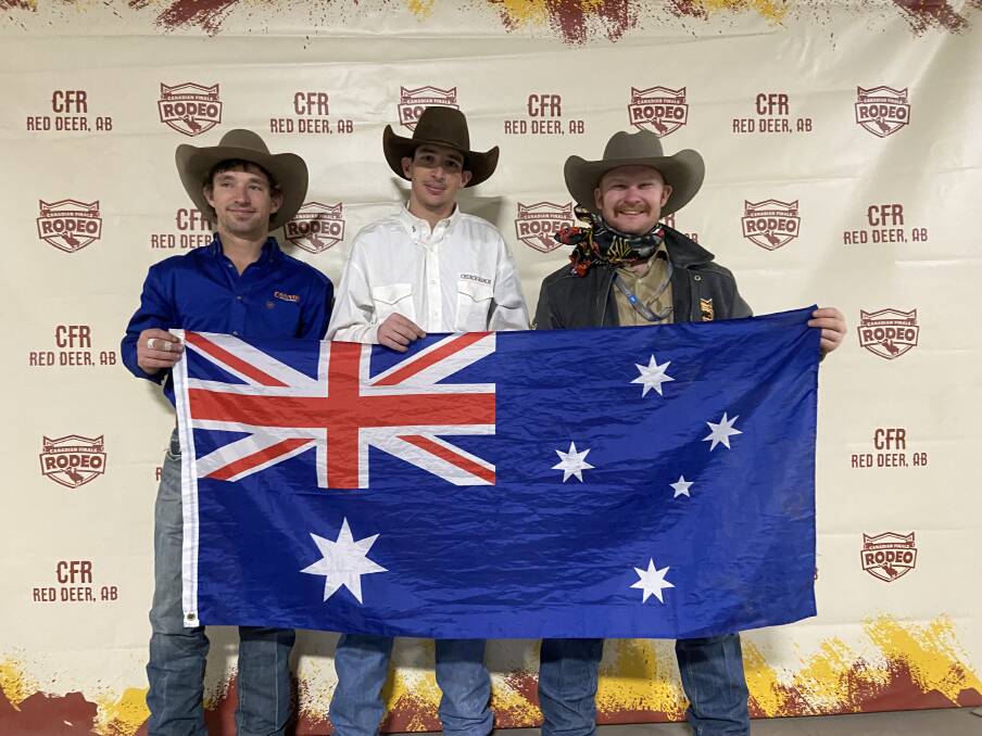 Callum and Lach Miller, and Strawbs Jones, flying the Australian flag at the Canadian Finals Rodeo in Alberta on the weekend.