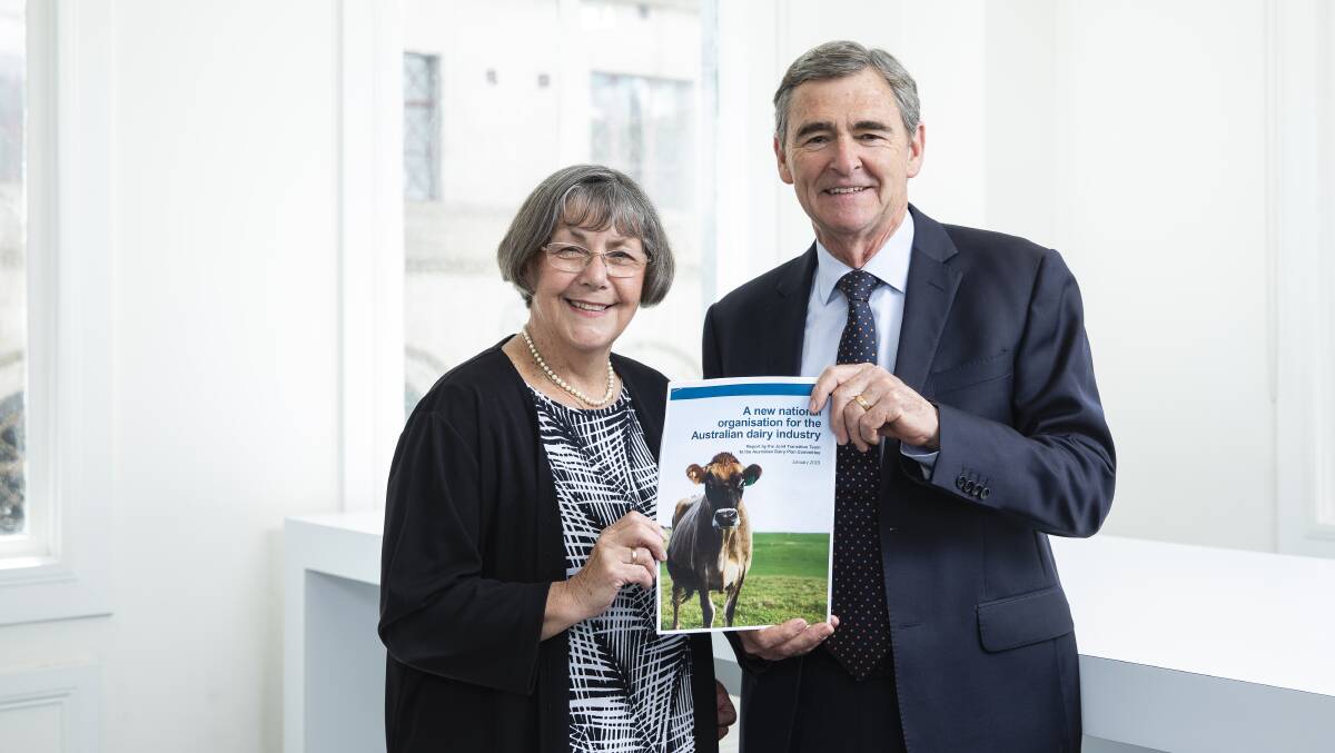 PLAN: Joint Transition Team chair Shirley Harlock, who developed the proposal for the single dairy organisation, hands the report to Australian Dairy Plan independent chair John Brumby early last year.