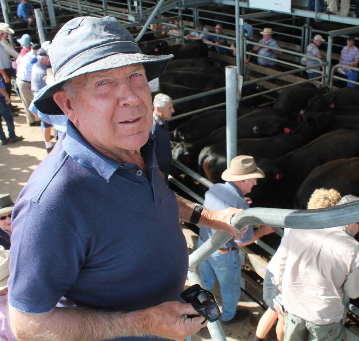 Alan Shalley offered the sale's first pen, 17 PTIC Angus cows, which sold to $1400. 