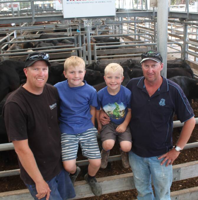 Scott Lockhart with sons Oliver and Miller, and Mark Lockhart sold 29 steers to $1150.