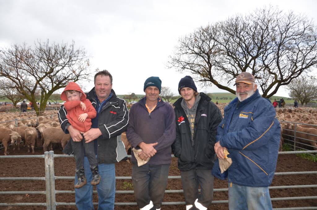 FAMILY AFFAIR: Ian Ferme, Georgetown, SA, holding his son Jackson with the Dennis family at Baroota, Rob, Matt and Peter. 