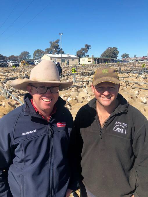 TOP: Tim Robinson from Paull & Scollard with Mat Wilson from "Lillawah" Gerogery who sold 74 new season lambs for $223.20 at Corowa this week.