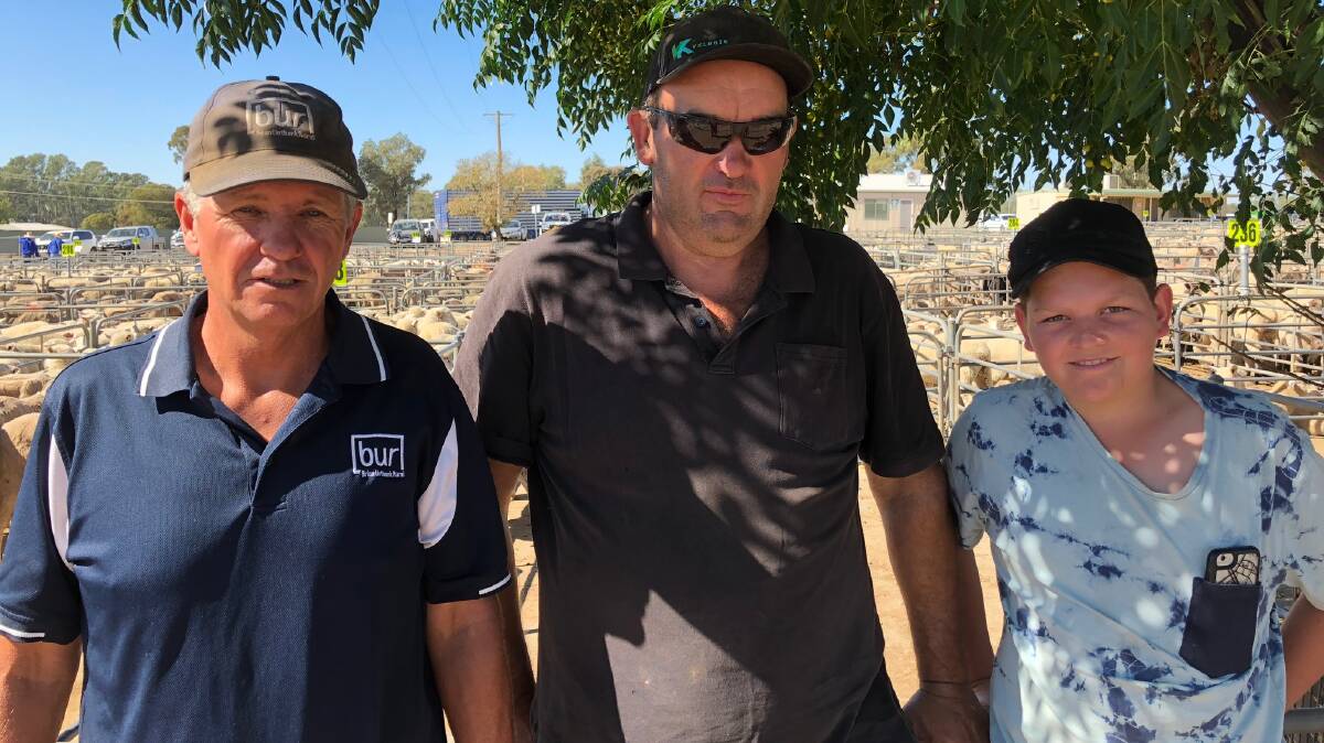 TOP PRICE: Micheal Unthank from BUR Albury with Brad Ewing and Bailey Constable from Howlong who sold 22 shorn lambs for $133.00 at Corowa saleyards.