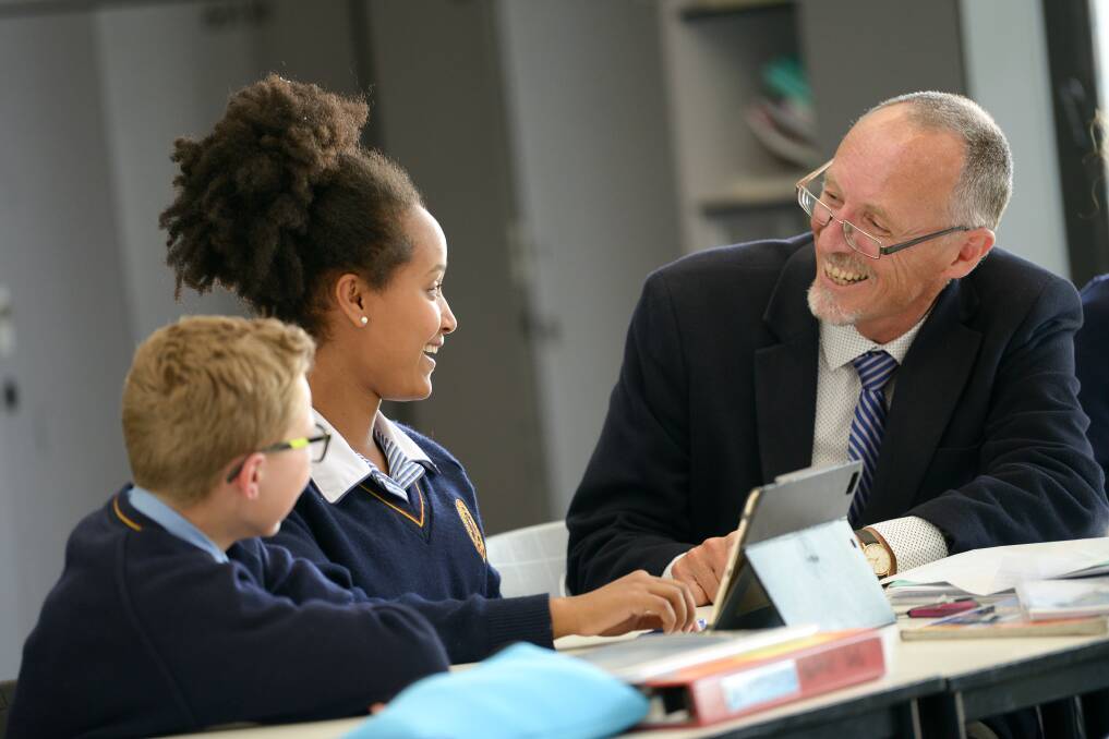 FOCUS ON LEARNING: Middle years students get some personalised attention from geography teacher Rob Drummond.