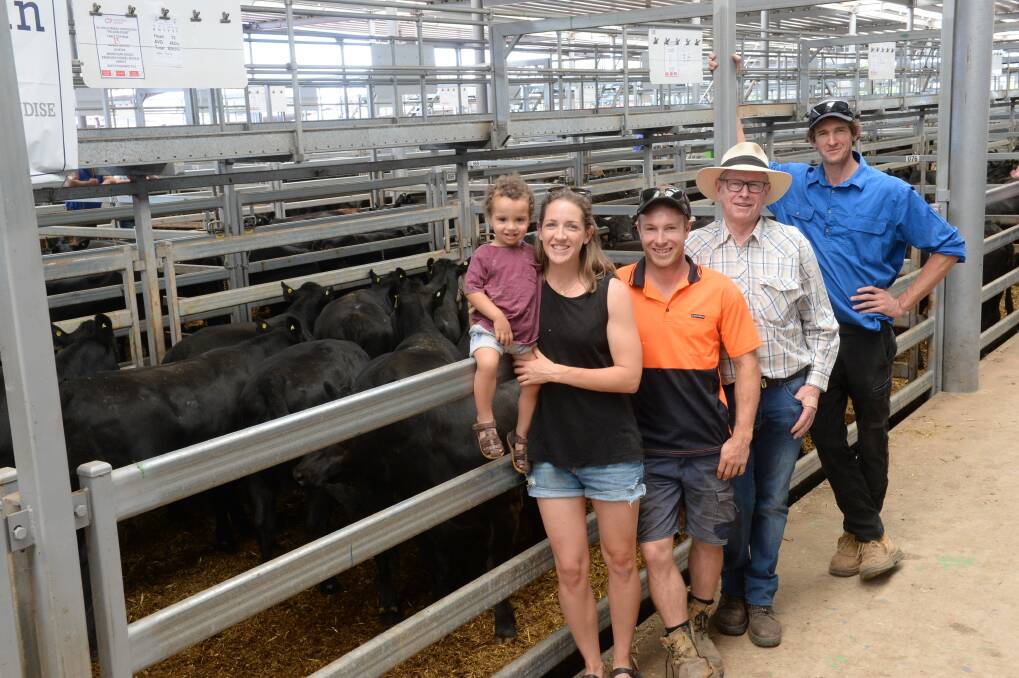 Tim Willis, Table Top, NSW, far right, with his uncle, Noel Willis, Table Top; cousin, Nick Willis, Cookardinia, NSW, and sister Liz Willis, Albury, with her son, Noah, 20 months, selling cattle at Wodonga.