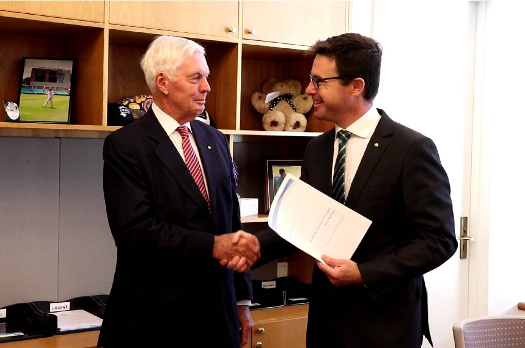 National Soils Advocate Major General Michael Jeffery presenting his policy report, ‘Restore the Soil: Prosper the Nation’ to the federal Agriculture and Water Resources Minister David Littleproud.