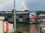 RAY OF HOPE: A rainbow over the flooded Brisbane Produce Markets gives a heartening sign as the facility attempts to resume trading tomorrow morning. Picture: Brisbane Markets Limited.
