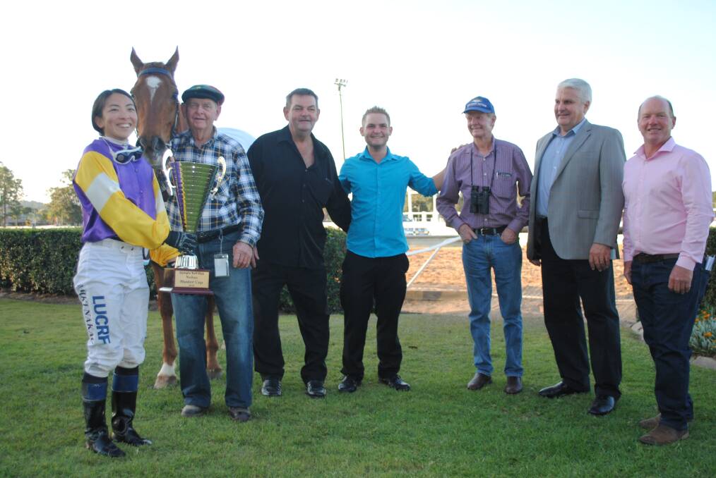 NOLAN MUSTER CUP WINNER: Eight year old gelding Fasta Than Light with jockey Miki Nakao, Cedric Duff, owners Glen Abbott and his son Nathan, trainer Pat Duff, sponsor Terry Nolan, and Gympie Turf Club president Shane Gill. 