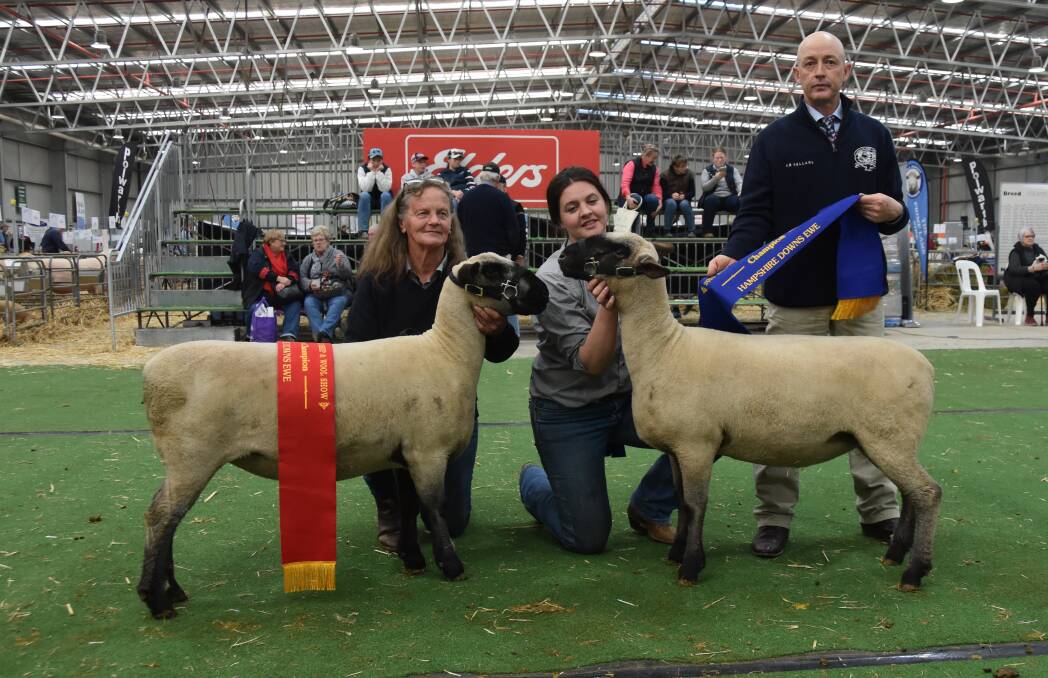 Helen Raven and Jessica Anderson, Jurambula, Henty, NSW, with their reserve champion and champion Hampshire Down ewe, while judge Chris Marr, Goolagong, NSW, holds the ribbon. Picture by Elizabeth Anderson