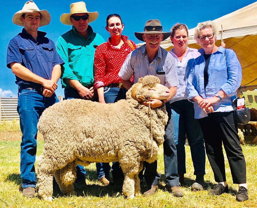 WELL BOUGHT: Tim Somerville, with Brendan and Kate Parker, stud principle Murray McKenzie, and Fiona and Elisabeth Prowse with their $1900 Lot 4 ram purchased.