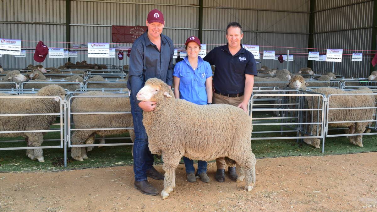 LUCKY THIRTEEN: The top pick of thirteen rams for volume buyer Hayley Reading, Callawadda, pictured with Andrew Hendy, Fox & Lillie Rural, Horsham, and Belbourie stud principal Paul Hendy.