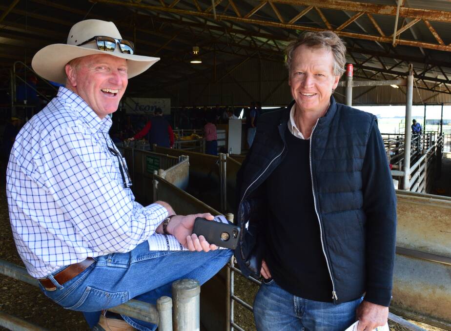 INTERSTATE VISITORS: Ian Ross, Holbrook, NSW, with successful bidder, Mark Boilieu, Crookwell, NSW. 