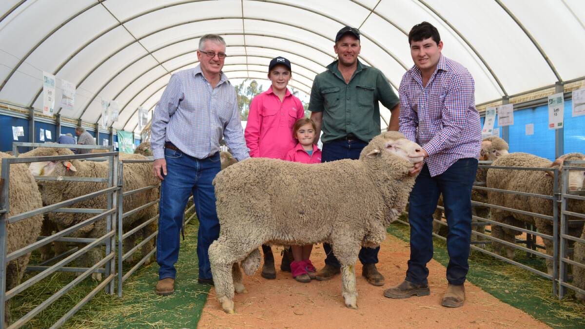 Successful first-time buyer, Mark Perryman, and daughters Eliza and Bridget, with Oakbank's Warren and Jack McRae, and the top ram.