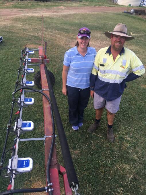 COST RELIEF: Darling Downs farmers Tabitha and Shane Peters with the new WeedSeeker 2 spot spraying system installed on their older, three-point linkage, 24-metre Hardi boomspray.