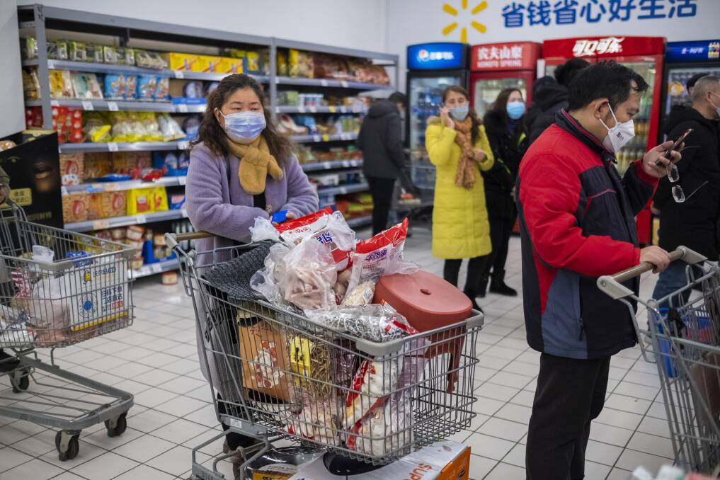 RELUCTANT SHOPPERS: The coronavirus outbreak has people in China reluctant to visit supermarkets and stores to buy food and other goods including clothing.