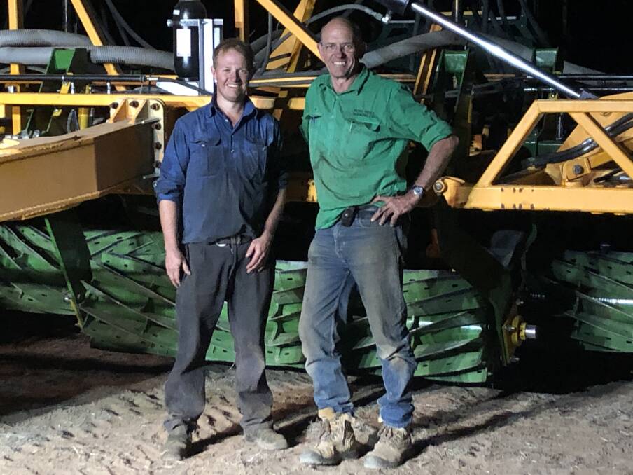 HAPPY PAIR: Charlie Lange, Auscrimper, Dalby, and Peter Thompson, Echo Hills, Roma, are all smiles after fitting roller crimpers to the front of Mr Thompson's chisel plough. 