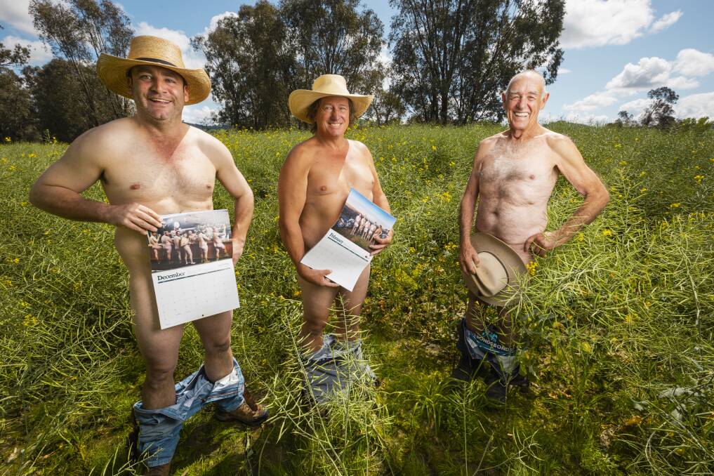 Hot off the press ... magnificent models Lachie Snow and Dick Shanahan with (centre) photographer Ben Simpson and the sizzling 2023 Hume Hunks & Hotties calendar supporting men's mental health. Picture by Ash Smith
