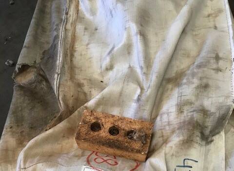 NO ROOM FOR COMPLACENCY: The house brick that was accidentally found in a bale of wool before it entered the scouring process. 