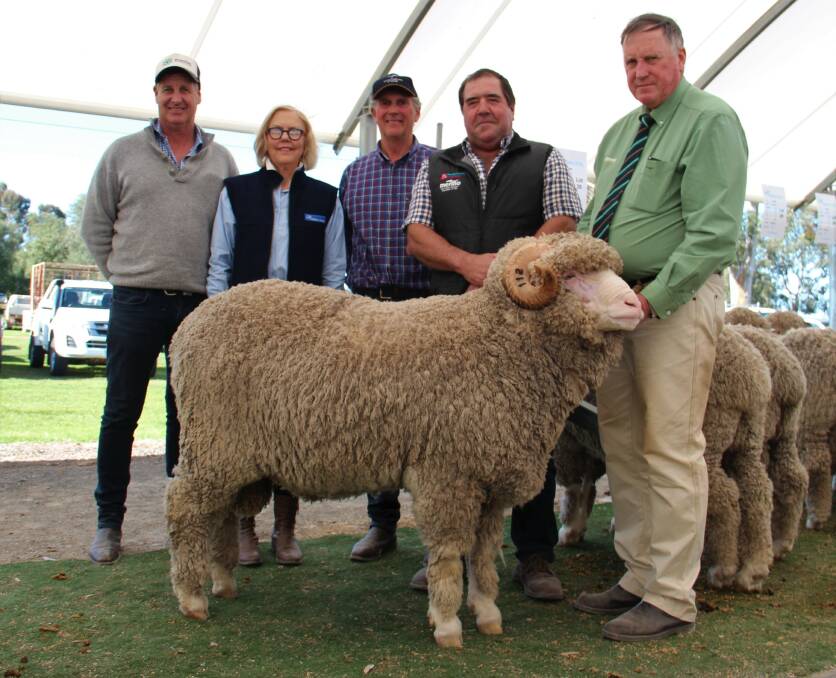 A SALE TO REMEMBER: The $52,000 ram sold by Wallallo Park stud, Victoria to Scott Pickering of Derella Downs Merino stud, Esperence, WA.Pictured from left to right is Paul Cousins (cousins Merino services) Jenny Carter, John Carter, Scott Pickering and holding the ram is Stephen Chalmers of Landmark stud stock.