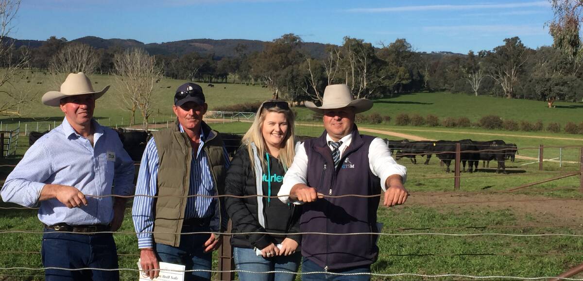 Jock Harbison with just two of the volume buyers, Nigel Meyer, "Westbrook", Singleton, bought five and Olivia Nicholos, Tollua Cattle Co, Merriwa, lead by example taking home 11, along with auctioneer, Michael Glasser.