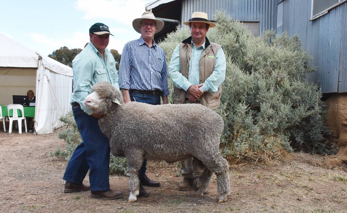 Pooginook's Shane Foster holds the $5000 Poll ram purchased by Rick Robertson of Gracemere Partnership, Bengworden, Victoria, with manager John Sutherland.
