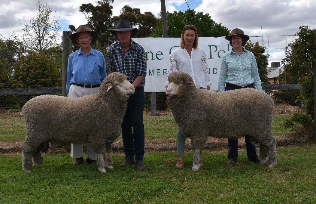 Dick Gavel, "Gulgo", Condobolin, with the two rams he purchased held by Alistair and Natasha Wells including the $9500 top price ram and Mr Gavel's daughter Caroline.