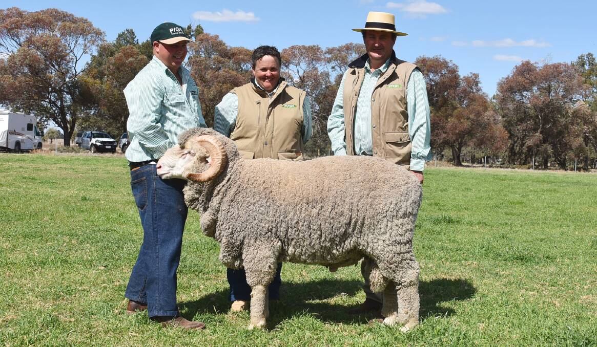 Pooginook staff Shane Foster, Katrina Lieschke, and manager John Sutherland with $7000 sale topper who was in the top five per cent for yearling weight, yearling clean fleece weight, merino production plus index.