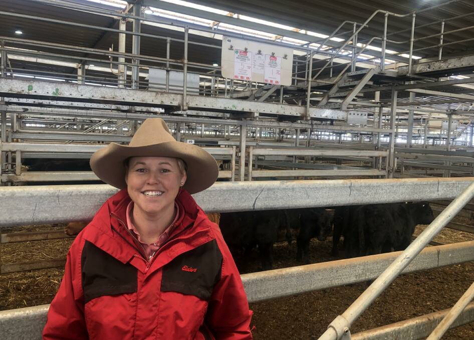 Kirsty Taylor, Elders with a pen of five Angus steers, 204kg, from Kywanna Pastoral Co, Wirlinga which sold for $1480. The same vendor sold 11 Angus steers, 271kg, for $1825, 673c/kg. Photo: NVLX
