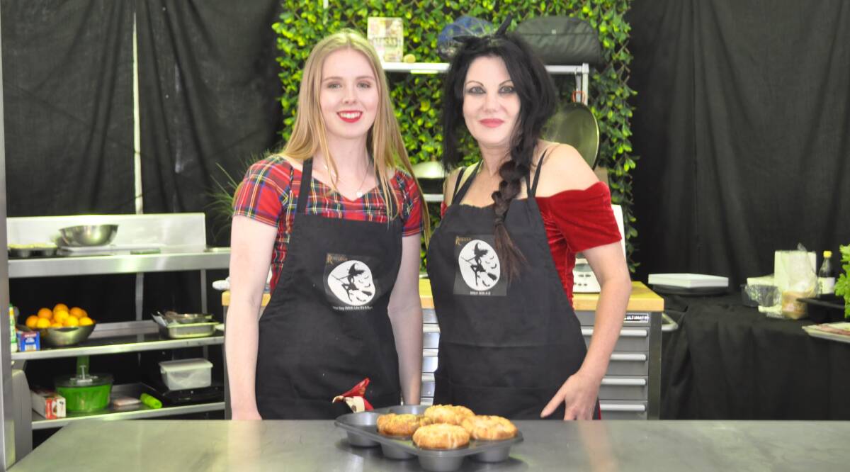 Willow Essex and Kate Wendt show off their Killer Pies at a cooking demonstration at the Henty Machinery Field Days. 