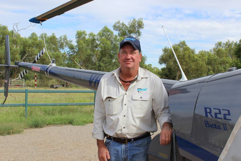 UP, UP AND AWAY: Barkly Helicopters owner and operator John Logan checks over his helicopters before mustering starts. Photo: Samantha Walton.